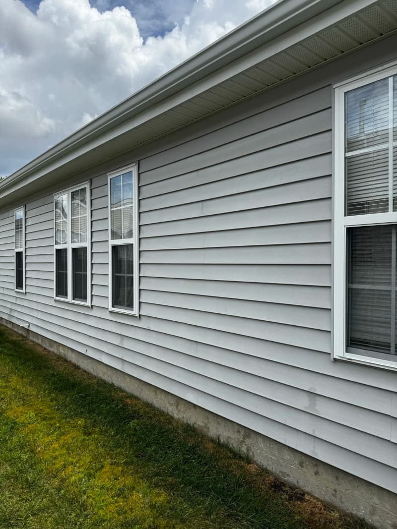 A long run of clean grey vinyl siding